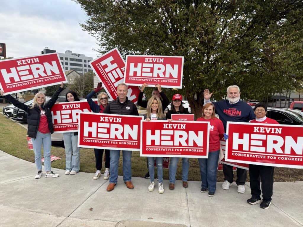 Kevin Hern campaign supporters holding signs for conservative candidate.