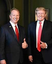 Kevin Hern with Donald Trump at a political event, smiling and giving a thumbs-up.